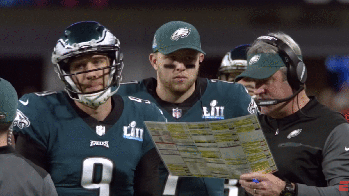 Football player and coach on the sideline
