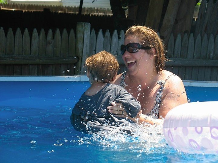 Rhonda Dorgan and Colin Dorgan playing in a pool.