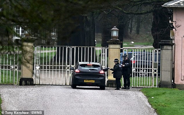 Windsor: Police officers seen at the gates of Andrew's former home in Berkshire, Royal Lodge