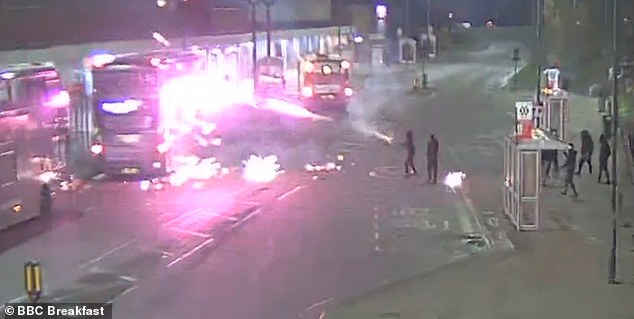 CCTV footage shows the shocking moment that masked teenagers threw a barrage of fireworks at buses over Halloween and Bonfire Night