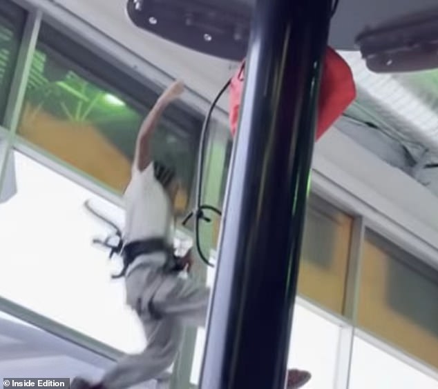 Just moments after stepping off the platform, he was seen plunging to the ground with his harness still attached to him