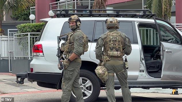 Dramatic scenes as tactical cops raid an underground carpark in Liverpool and arrest a man in nearby Busby after terrifying home invasion