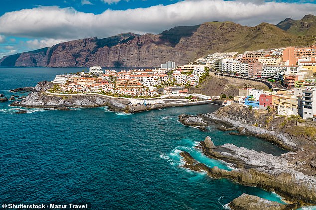 Boy, ten, is hacked to death with a machete and mother left fighting for life before Tenerife cops shoot crazed father dead