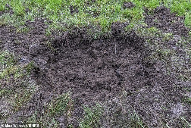 The controlled explosion left a large crater (pictured) on the grounds of the site