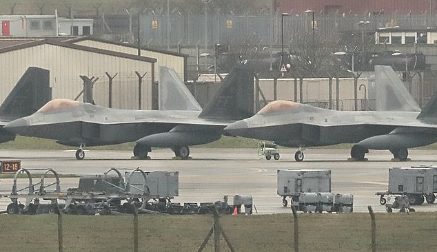 US Air Force F-22s in the UK, on the way to the Middle East to support B-2 bombers, pictured at RAF Lakenheath today
