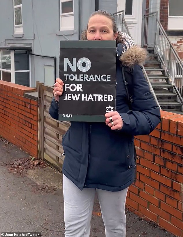 Jean Hatchet's partner (pictured) carried a sign that read 'no tolerance for Jew hatred'