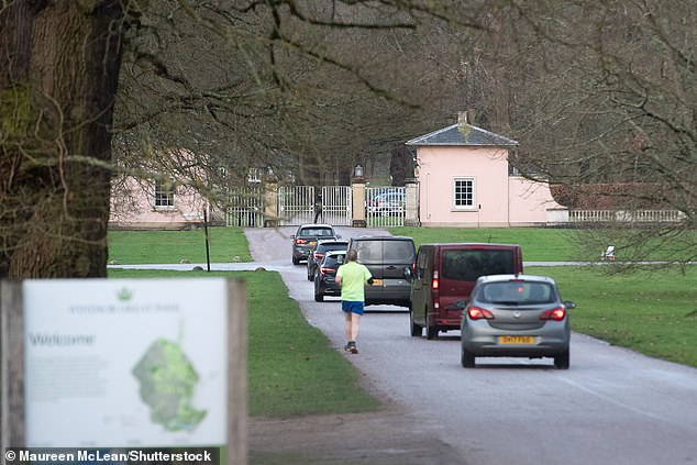 A convoy of unmarked police vehicles arriving at the gates to Royal Lodge in Windsor Great Park  first thing this morning