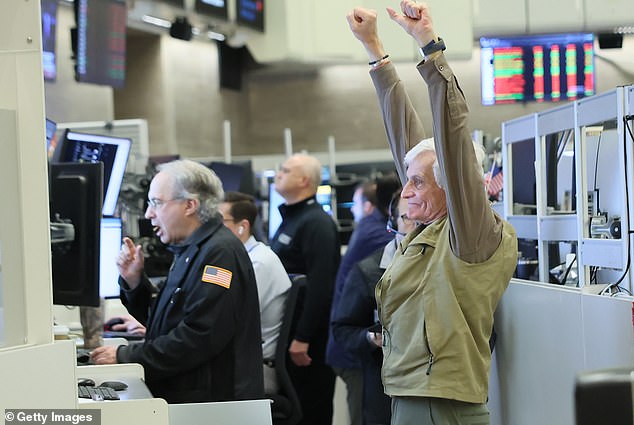 Traders work the floor on Friday as the Supreme Court ruled against President Donald Trump's widespread tariff policy