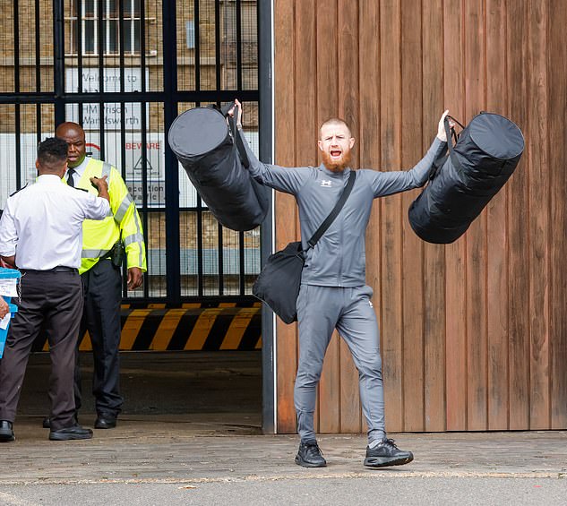 Pictured: A man celebrates as he is released from HMP Wandsworth where a new scheme trialling alarm clocks has been introduced