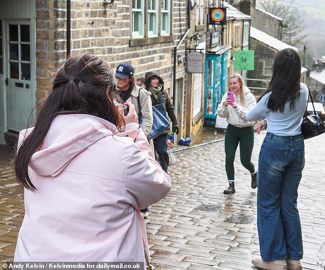 But now, after the release of the much-hyped Hollywood version of Wuthering Heights, a tidal wave of tourists (pictured) has begun descending onto its tiny cobbled streets