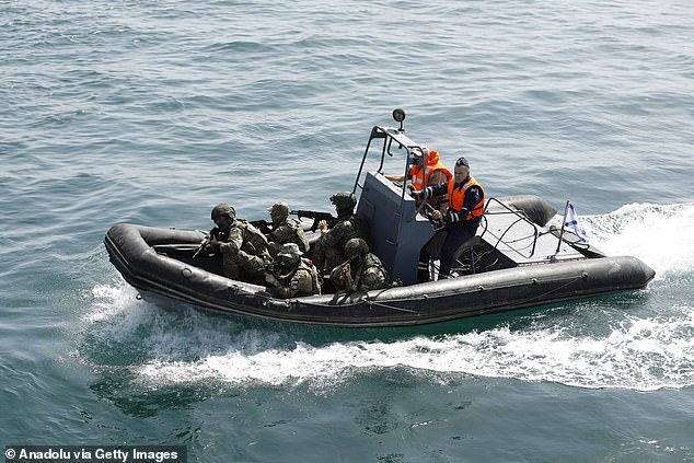 Naval units from Iran and Russia carry out to simulation of rescue a hijacked vessel during the joint naval drills held at the Port of Bandar Abbas near the Strait of Hormuz