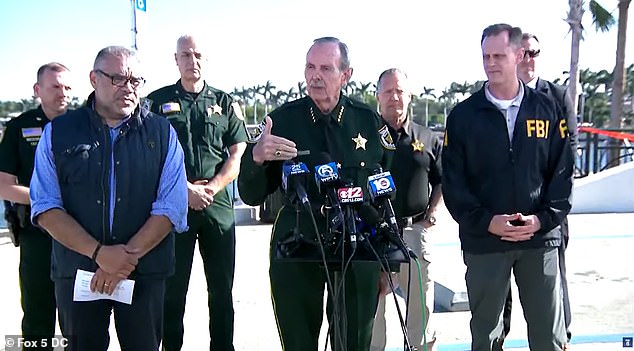 Two Secret Service agents and one deputy from the Palm Beach County Sheriff's Office ordered him to drop his weapons before shooting him dead, Sheriff Ric Bradshaw (center) said