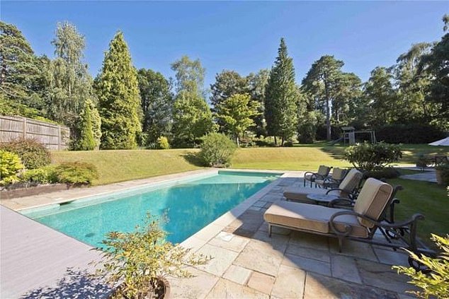 A look at the stunning outdoor pool which is surrounded by trees