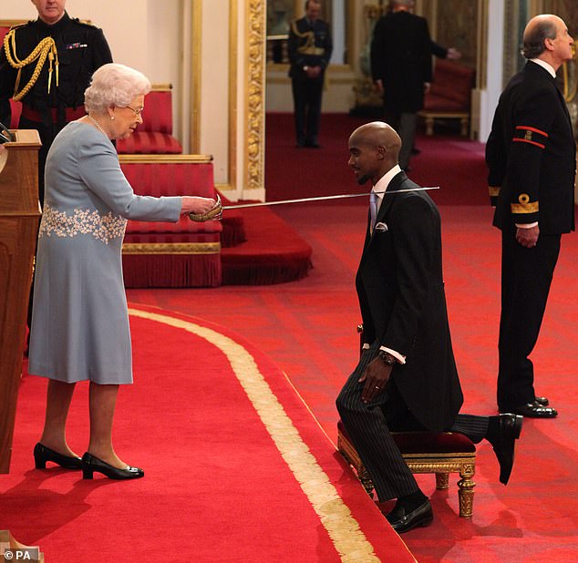 Sir Mo kneels as he is made a Knight Bachelor of the British Empire by the Queen at a Buckingham Palace ceremony in November 2017