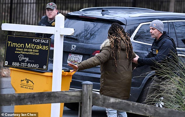 Goode's husband Corey Pollard is seen being taken away by police officers last month. He has a lengthy criminal record