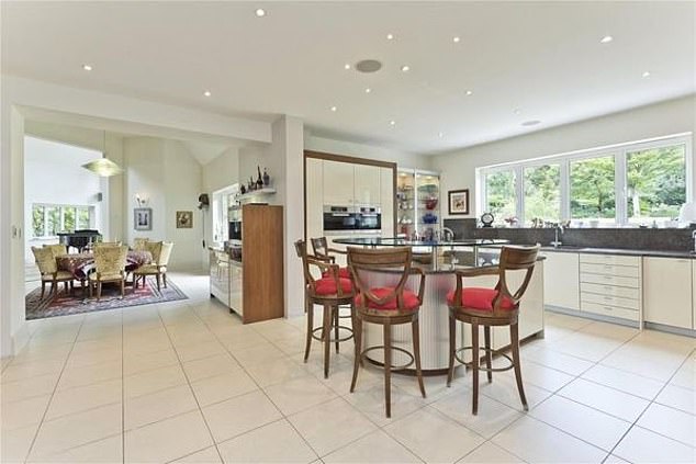 The upmarket estate agents told prospective buyers: 'The true heart of this home is the open plan kitchen/breakfast room'