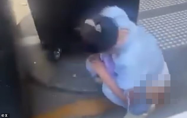 An upset worker lectured the woman, who was seen pooping near other people and cars