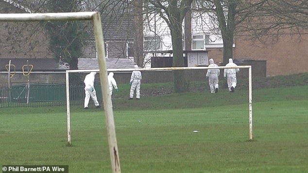 Forensic officers pictured on Thursday inspecting the scene of the stabbing at Briar Hill Skate Park in Northampton
