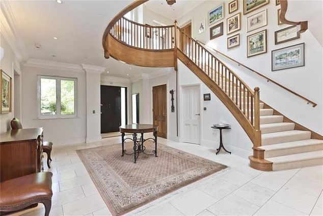 The ground floor of the property has an impressive reception hall, pictured here