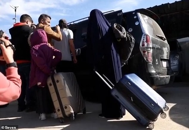 The women and 23 children - all linked to Islamic State members - were granted documents to travel to Australia