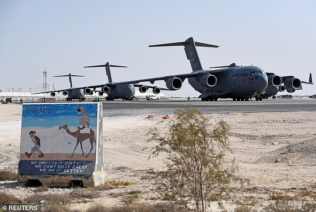 New reports have claimed that hundreds of personnel at a base in Qatar were relocating ahead of a possible military strike against Iran. The Udeid Air Base in Qatar is pictured above in 2021