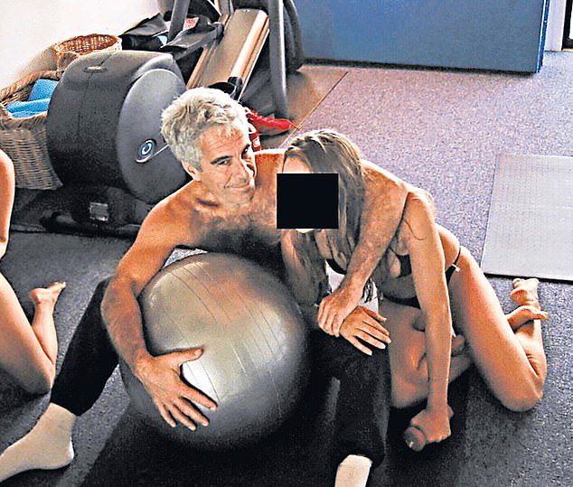 Epstein is pictured with a young woman who appears to be in her underwear in a photograph released as part of the Epstein files. The image shows another woman or girl who appears to be wearing underwear or nothing at all. It is not clear where the image was taken or when