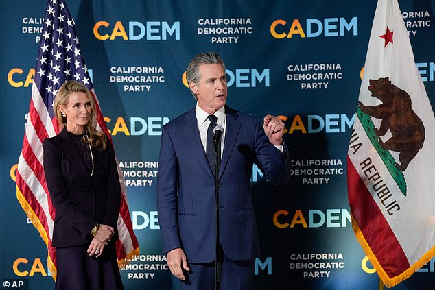 Gavin Newsom stands with first partner Jennifer Siebel Newsom at a California Democratic Party office Tuesday, November 4, 2025, in Sacramento