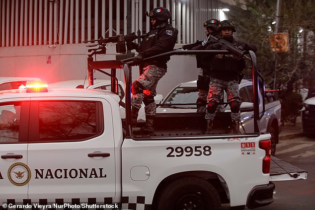 A National Guard convoy in Mexico City, Mexico, on February 22, 2026, escorts a Rhino, an armored tactical vehicle used for high-impact operations and critical security situations