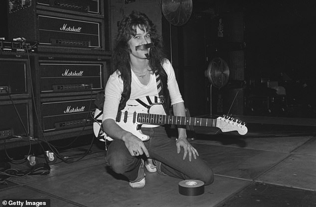 American guitarist and songwriter Eddie Van Halen in front of a stack of Marshall amps before a Van Halen concert in 1978