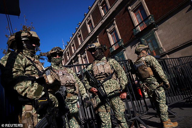 Members of the army patrol the perimeter of Palacio Nacional in Mexico City, where President Claudia Sheinbaum held her morning press conference, on Monday