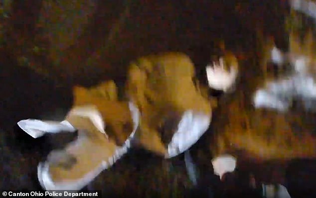 But Cain threw herself onto the ground in apparent protest