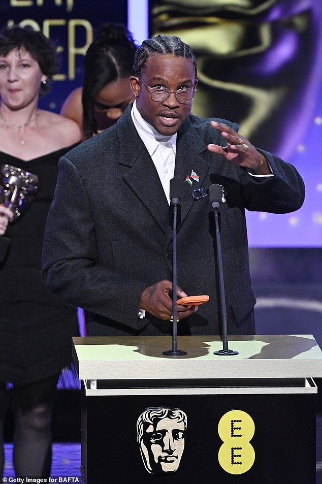 In contrast, the BBC edited out 'Free Palestine' from an acceptance speech made by filmmaker Akinola Davies Jr (pictured)