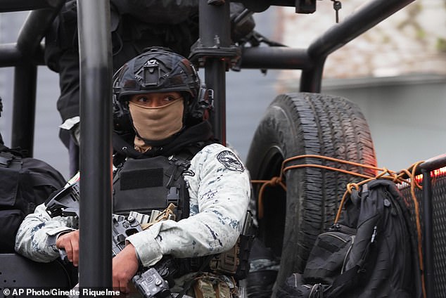 A National Guard patrols the area outside of the General Prosecutor's headquarters in Mexico City on Sunday