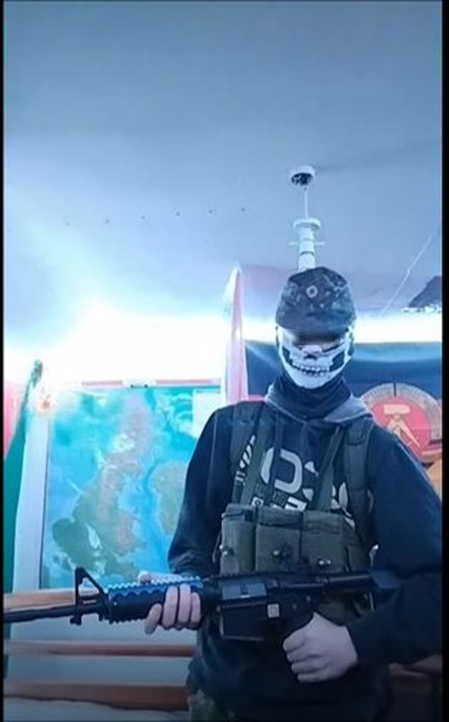 A video downloaded from the boy's laptop showed a figure holding a rifle and wearing a skeleton mask