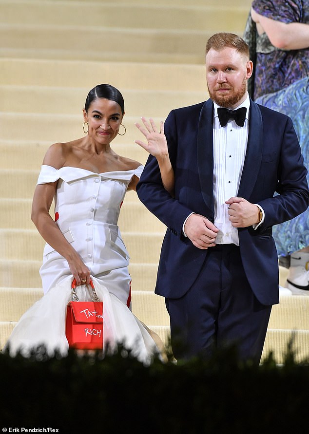 As she responded to a prompt to 'just understand foreign policy before running for president,' someone is clearly heard snoring, presumably Ocasio-Cortez's fiance Riley Roberts (pictured right)