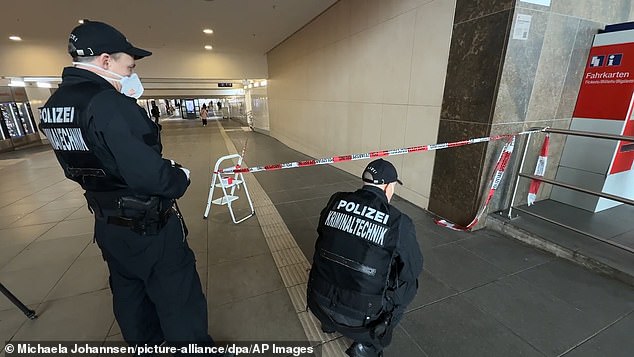 Afghan knifeman attacks multiple people at Jehovah's Witness stand in German train station before being overpowered by hero civilians