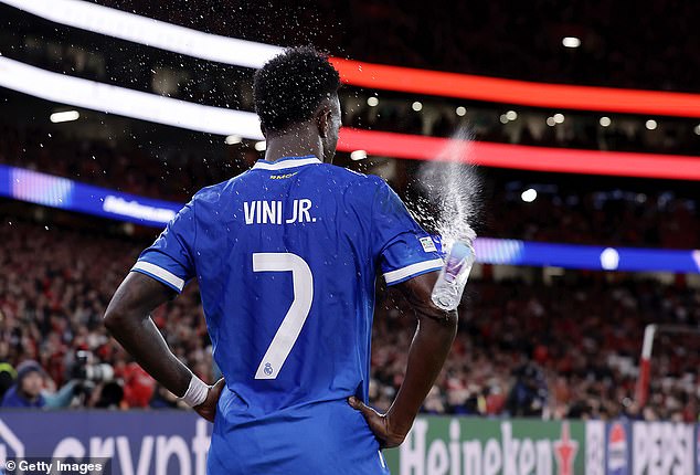 A bottle is thrown at Vinicius during the Benfica game as he waits to take a corner
