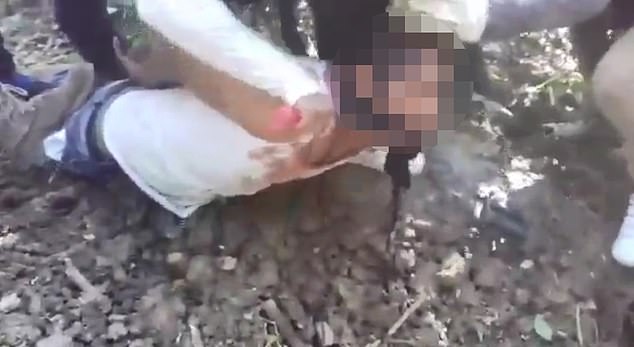 In a gory video shows members of the CJNG cartel beheading an unnamed man