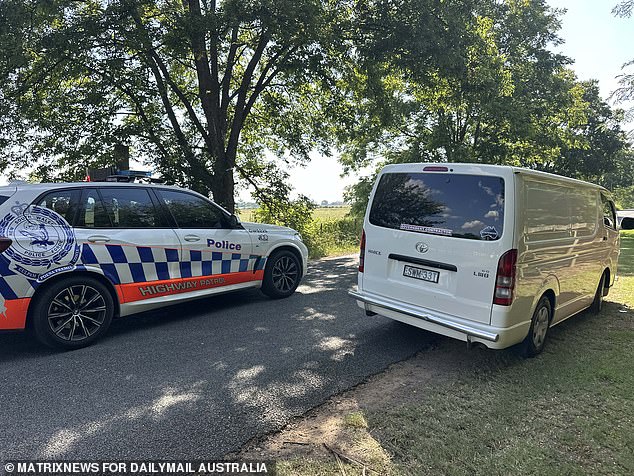 Pictured: A white coroner's van arrives at the scene to collect the body of kidnapped grandfather Chris Baghsarian