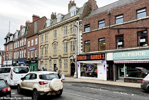 Council planners said the sign fails to 'respect the established character' of the site, alongside listed buildings in the medieval town