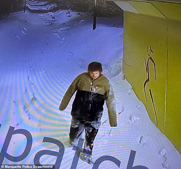 Officials said Massey appeared to be 'disoriented and having trouble walking,' as he is pictured wearing an olive-green and black jacket with dark pants