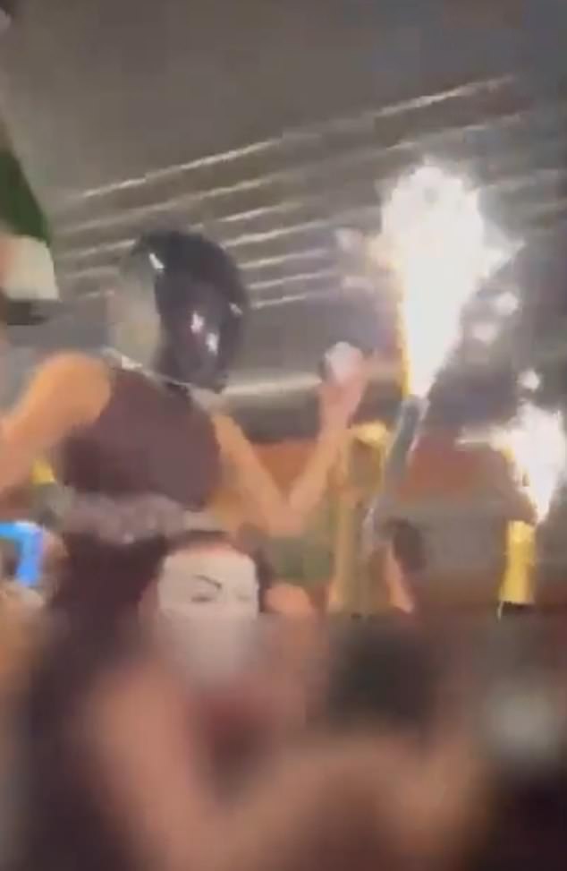 The video lays bare just how quickly the blaze took hold, and hints at why dozens of revellers did not immediately realise the danger above their heads
