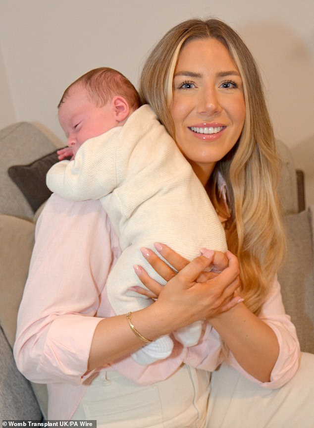 Grace Bell with her baby son Hugo Powell, the first child in the UK to be born to a mother using a womb from a dead donor