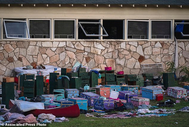 The belongings of campers sit outside one of Camp Mystic's cabins near the Guadalupe River after a deadly flash flood swept through the area