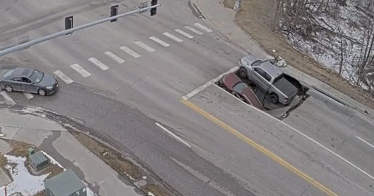 Wild Footage Shows Multiple Vehicles Fall Into Sinkhole At Intersection