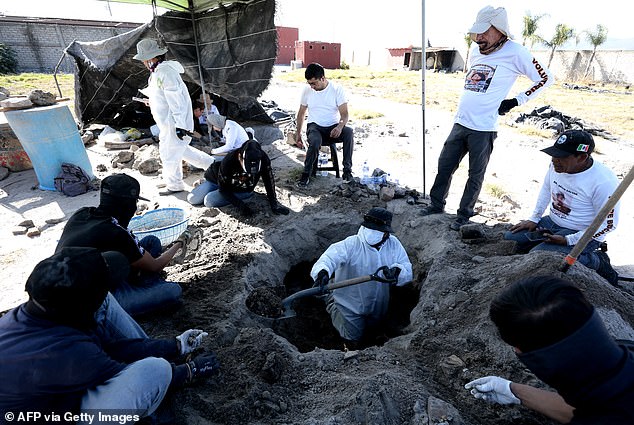 Members of the collective 'Guerreros Buscadores' work on three human crematoriums found while searching for their relatives at Izaguirre Ranch on March 5, 2025