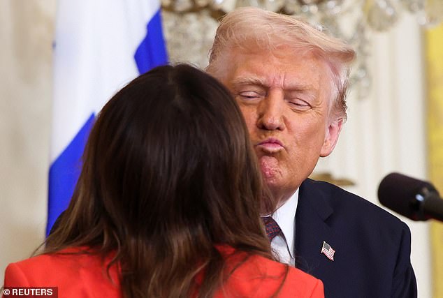 Trump hugs Guilfoyle, during the Greek Independence Day celebration at the White House back in March of last year