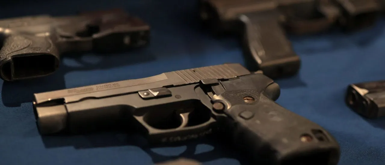 NEW YORK, NEW YORK - JUNE 03: Confiscated guns are displayed on a table ahead of a New York Mayor Eric Adams press conference on Public Safety at City Hall on June 03, 2025 in New York City. Adams and NYPD Commissioner Jessica Tisch held a press conference announcing the lowest number of shootings and homicides in recorded history during the first five months of 2025. (Photo by Michael M. Santiago/Getty Images)