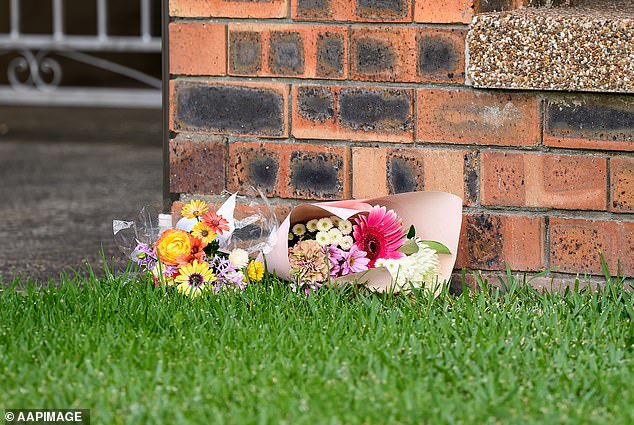 Floral tributes were seen outside Chris Baghsarian's home in North Ryde on Wednesday