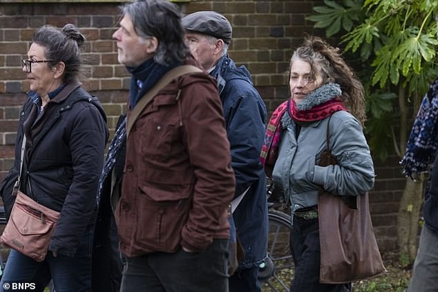 Ruth McGill (pictured in a green jacket, right) arriving at County Hall Dorchester on Thursday